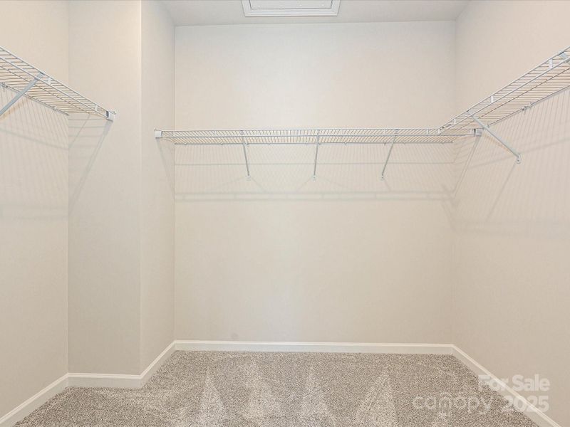 Primary Walk-In Closet With More Than Enough Space. Primary Walk-In Closet With More Than Enough Space.