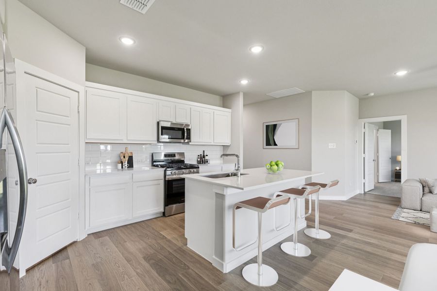 Kitchen in the Harper home plan by Trophy Signature Homes – REPRESENTATIVE PHOTO