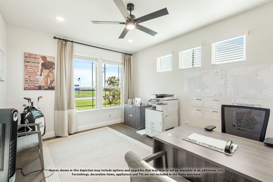 Home office with wood desk, ceiling fan, printer, and windows with natural light Home office with wood desk, ceiling fan, printer, and windows with natural light