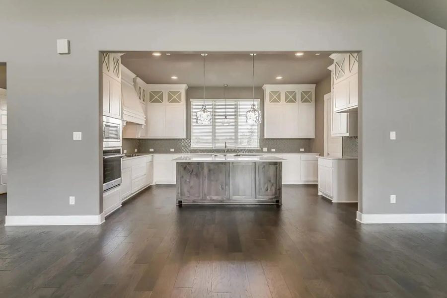 Representative furnished interior of a home built from the The Carter by Elmwood Custom Homes in Ranch at Stone Hill, Waxahachie (Image 20).