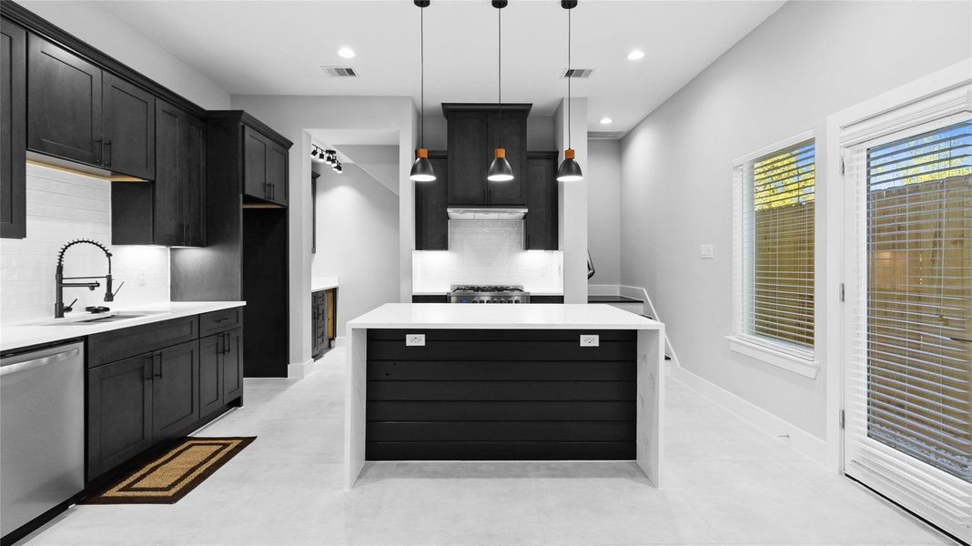 The kitchen island is where you gather most, whether for a quick breakfast or setting out snacks when friends come by. The kitchen island is where you gather most, whether for a quick breakfast or setting out snacks when friends come by.