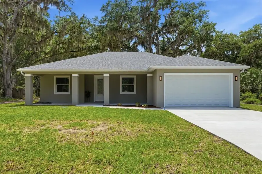 Front exterior of a new home in , Deland, FL, highlighting curb appeal (Image 24).