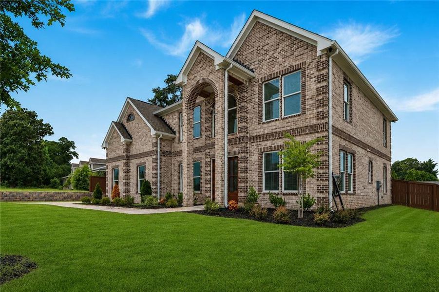 Front exterior of a new home in , Norcross, GA, highlighting curb appeal (Image 26). Front exterior of a new home in , Norcross, GA, highlighting curb appeal (Image 26).