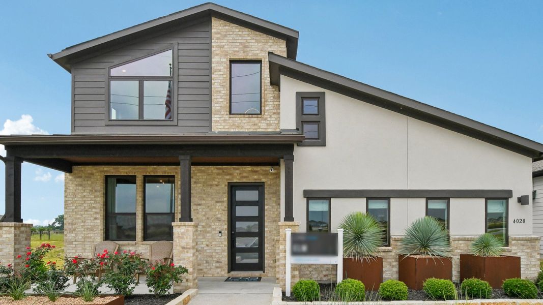Representative exterior photo of a completed home built from the Elm by DRB Homes in Preserve at Lakeside Meadows, Pflugerville, TX (Image 21). Representative exterior photo of a completed home built from the Elm by DRB Homes in Preserve at Lakeside Meadows, Pflugerville, TX (Image 21).