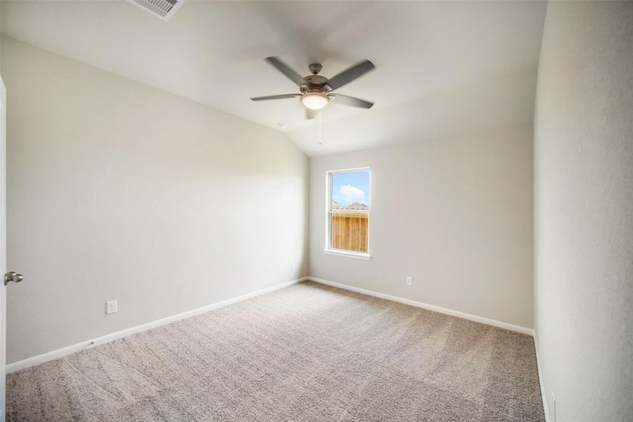 Generously sized secondary bedrooms featuring spacious closets, soft and inviting carpeting underfoot, large windows allowing plenty of natural light, and the added touch of privacy blinds for your personal retreat. Sample photo of completed home with similar floor plan. Actual colors and selections may vary.