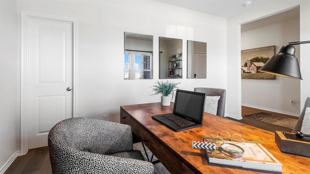 Versatile room featuring wood-finish flooring and a solid panel door