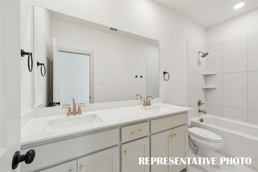 Guests will enjoy their own vanity space in this thoughtfully designed guest bath.  REPRESENTATIVE PHOTO