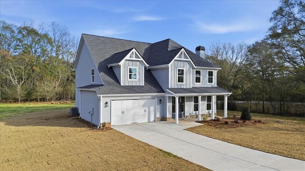 Front exterior of a new home in , Statham, GA, highlighting curb appeal (Image 1). Front exterior of a new home in , Statham, GA, highlighting curb appeal (Image 1).
