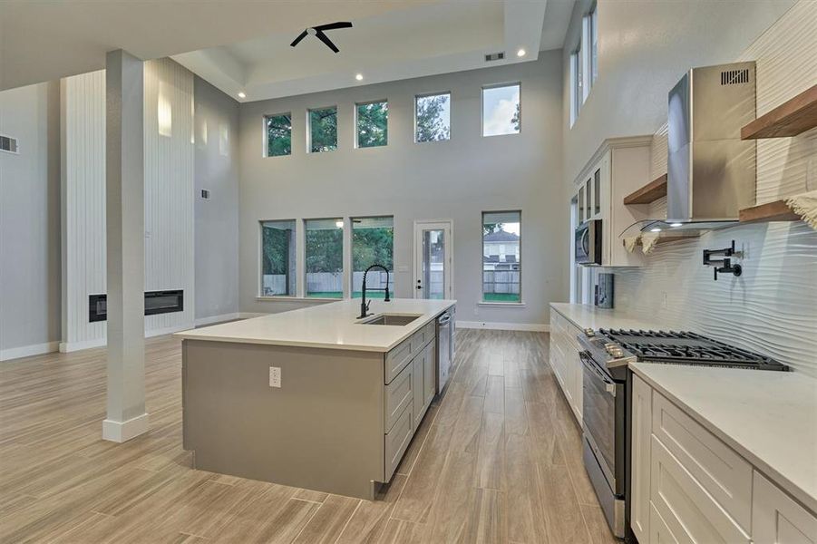 Another view of the kitchen and living room area. There is a great amount of counter space in this kitchen!