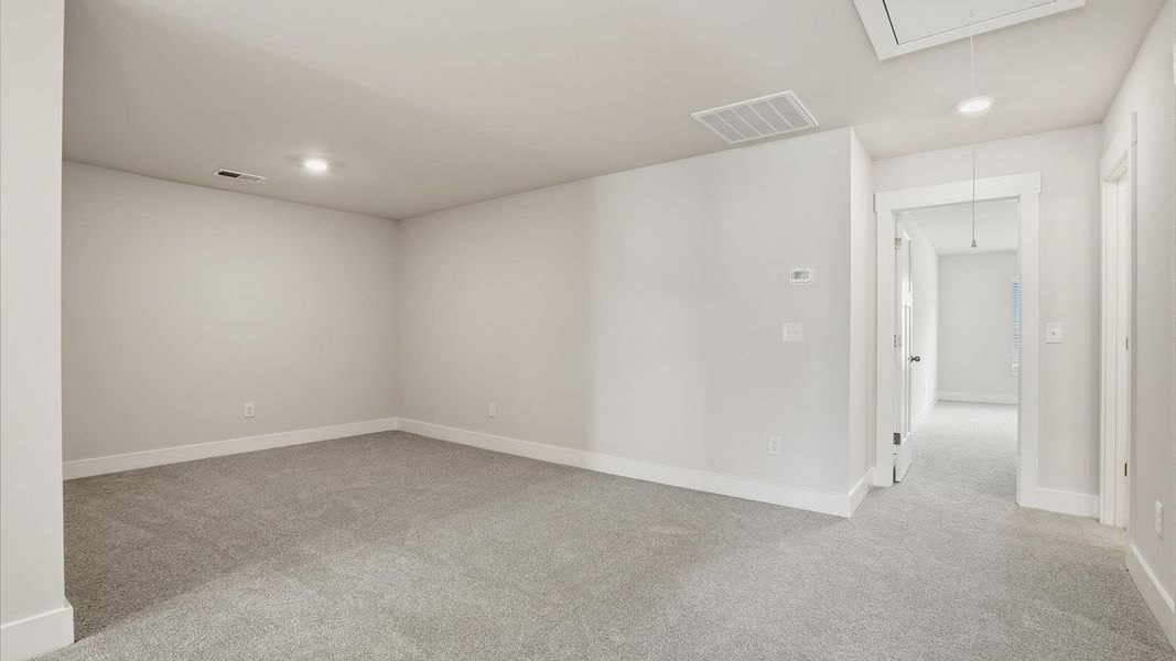 Vibrant carpeted loft offering flexibility as a study nook, game room, or second family space in Anderson, SC Vibrant carpeted loft offering flexibility as a study nook, game room, or second family space in Anderson, SC