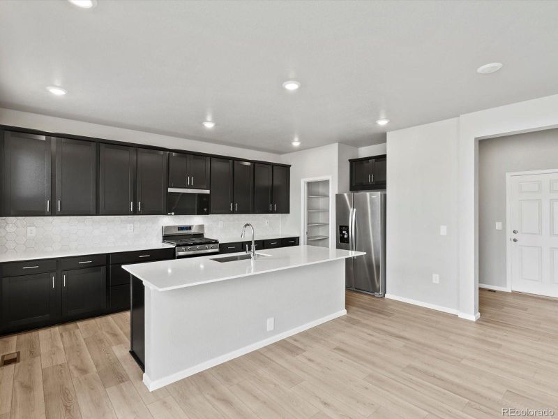 Furnished interior view inside a new home in Poudre Heights: The Alpine Collection, Windsor (Image 9).