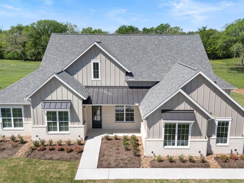 Front exterior of a new home in , Smithville, TX, highlighting curb appeal (Image 28).
