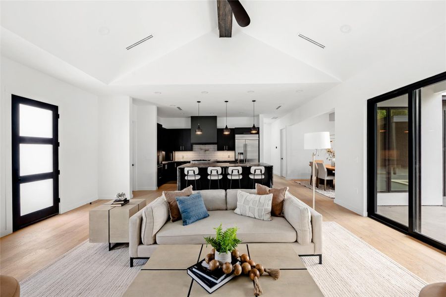 Living room featuring healthy amount of natural light and light wood-style floors