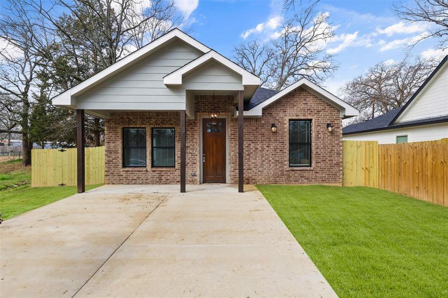 View of front of property with a front yard