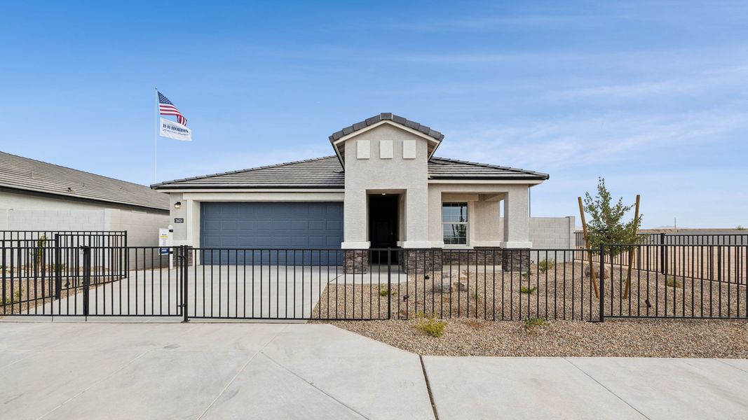 Representative exterior photo of a completed home built from the Hayden by D.R. Horton in Remington, Buckeye, AZ (Image 18).