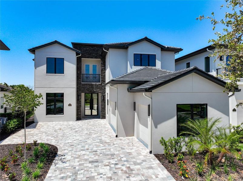Front exterior of a new home in , Kissimmee, FL, highlighting curb appeal (Image 21).