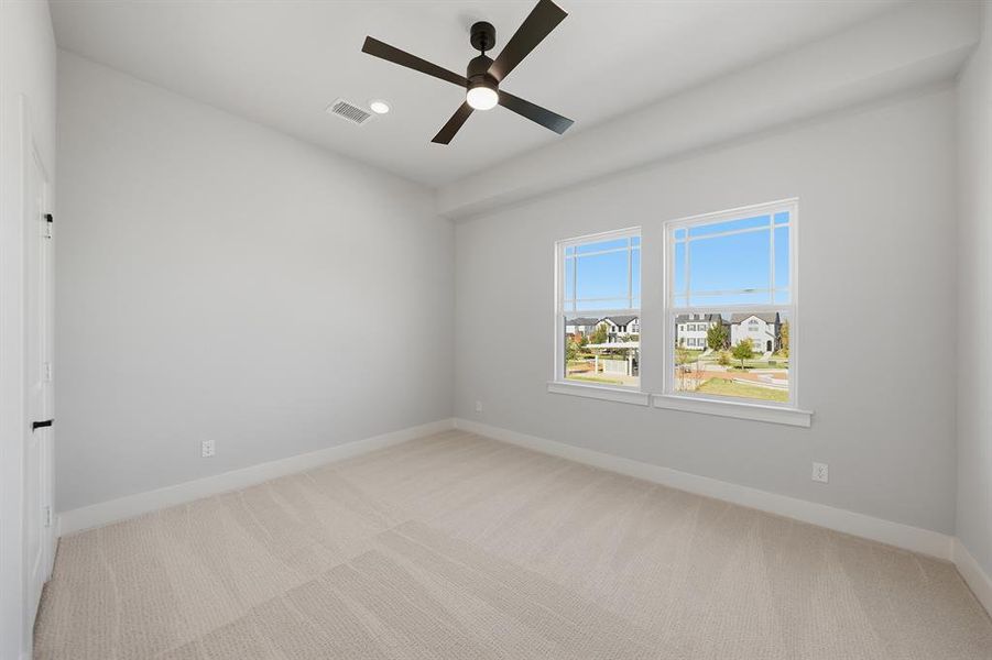 Unfurnished room featuring light carpet, ceiling fan, and recessed lighting