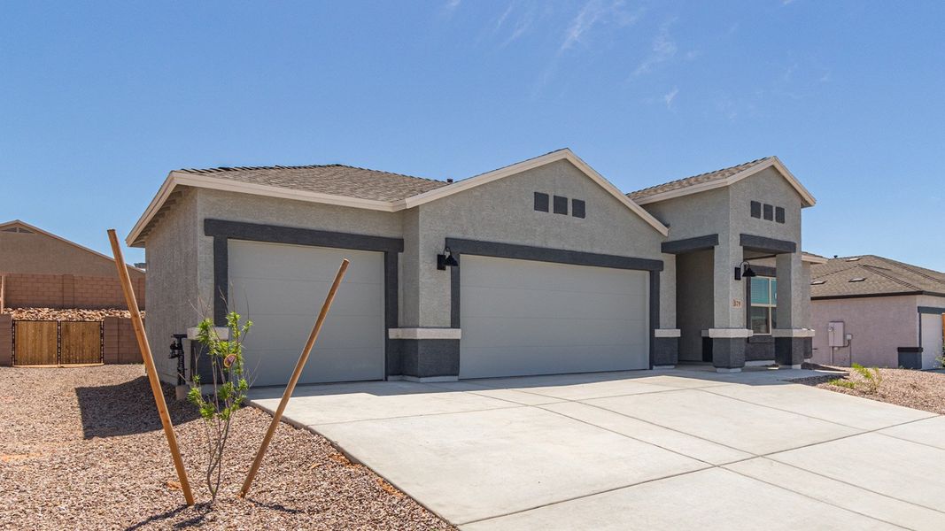 Front exterior of a new home in Sycamore Vista, Vail, AZ, highlighting curb appeal (Image 18).