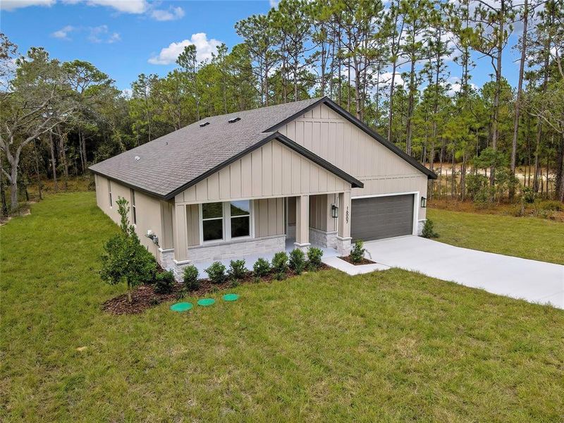 Front exterior of a new home in , Weeki Wachee, FL, highlighting curb appeal (Image 30).