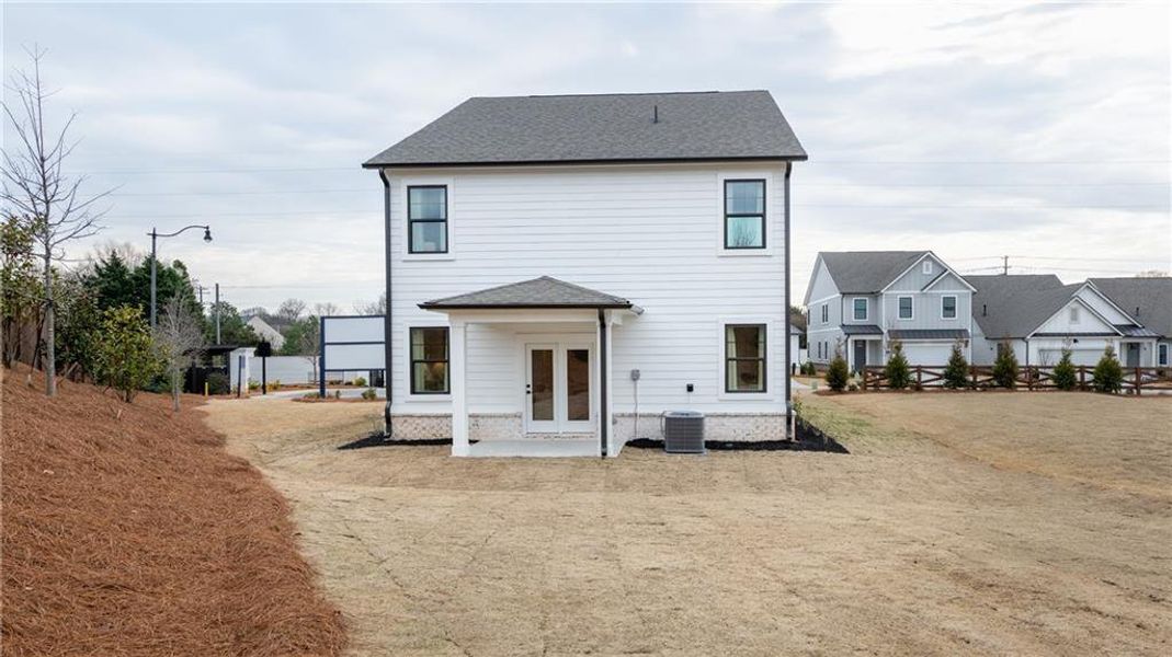 Exterior details and patio area of a home in The Village at Sandy Plains, Marietta (Image 27).