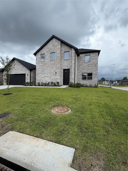 Front exterior of a new home in , Spring, TX, highlighting curb appeal (Image 16).