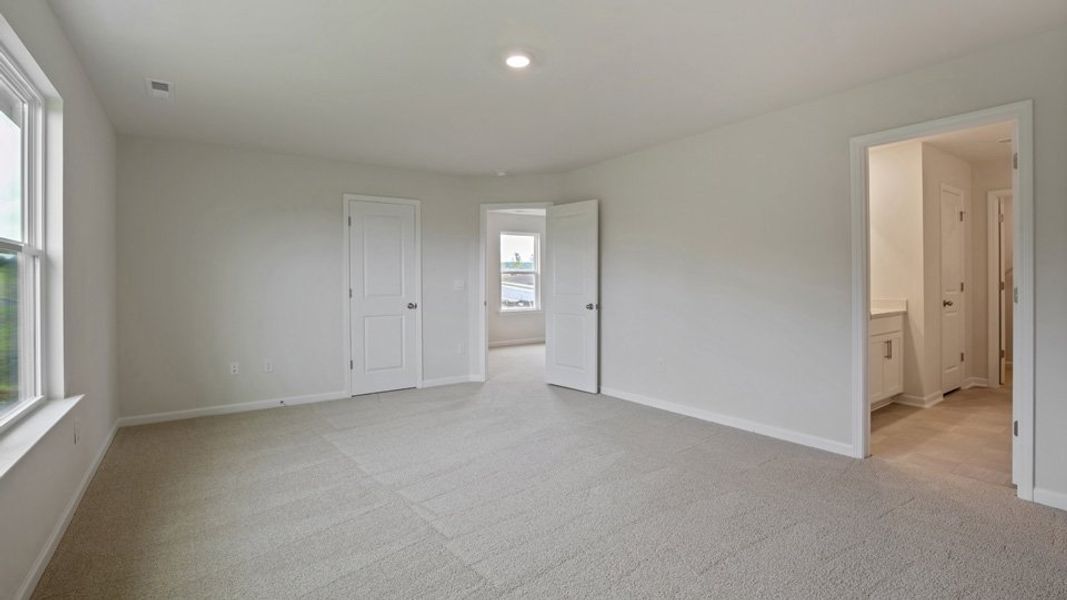 Spacious, unfurnished interior of a new home in The Grove at Matthews Landing, Fuquay Varina (Image 28).