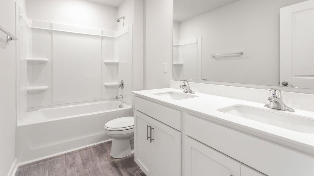 Representative furnished interior of a home built from the PENWELL by D.R. Horton in English Farm, Archdale (Image 7).