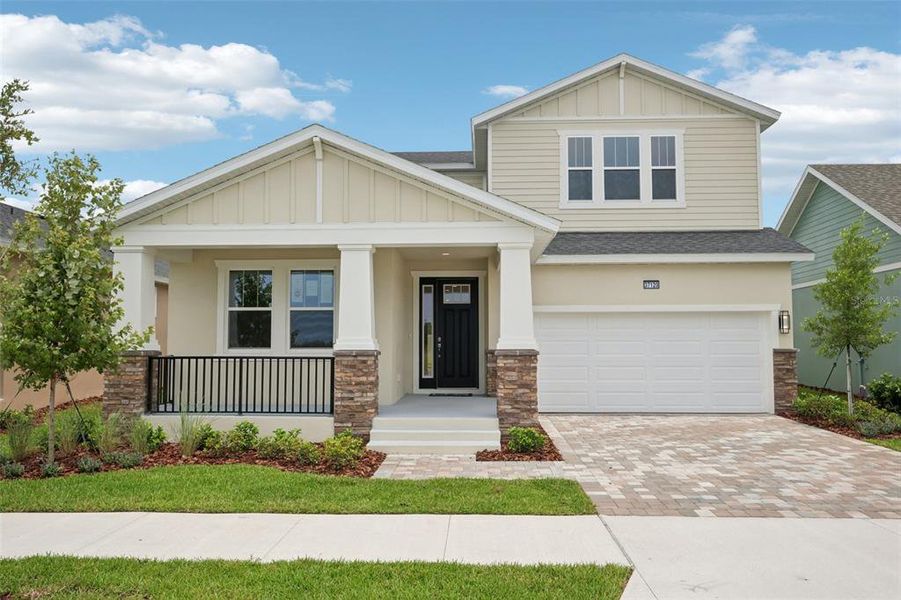 Front exterior of a new home in Primrose at Longleaf, New Port Richey, FL, highlighting curb appeal (Image 27).