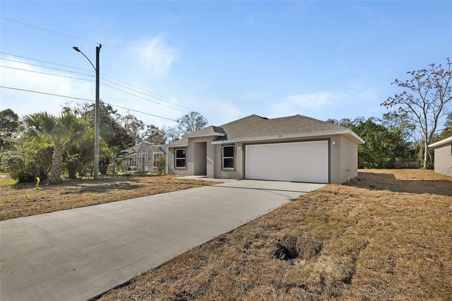 Front exterior of a new home in , Daytona Beach, FL, highlighting curb appeal (Image 1). Front exterior of a new home in , Daytona Beach, FL, highlighting curb appeal (Image 1).