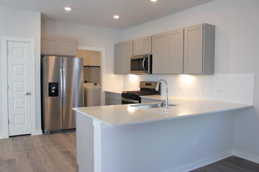 Furnished interior view inside a new home in The Hollows at Avery Centre, Round Rock (Image 4). Furnished interior view inside a new home in The Hollows at Avery Centre, Round Rock (Image 4).