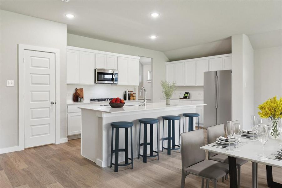 Kitchen in the Heisman home plan by Trophy Signature Homes – REPRESENTATIVE PHOTO