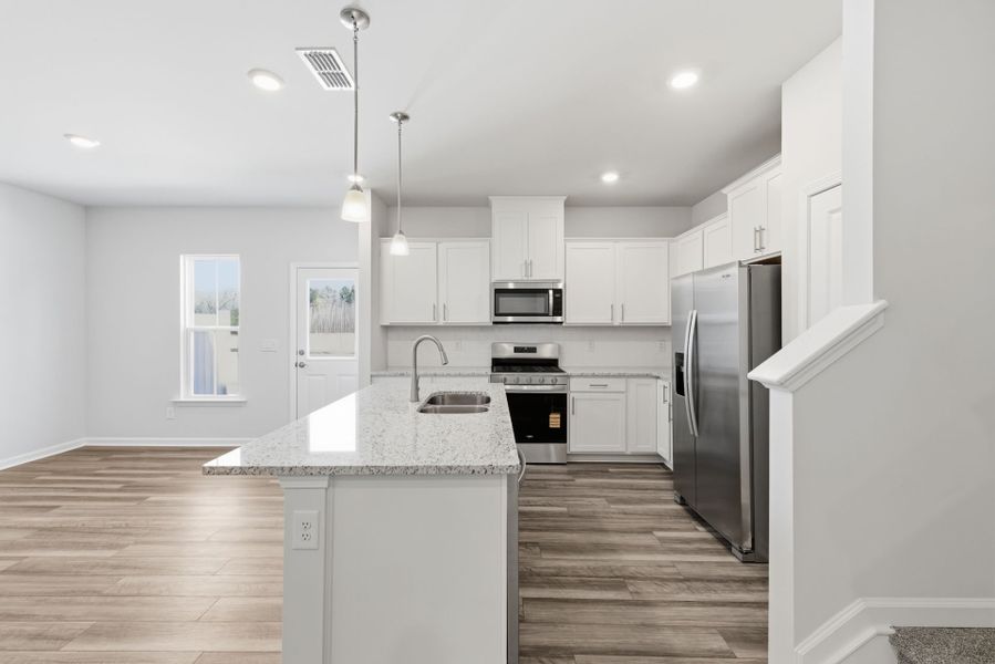 Furnished interior view inside a new home in Poets Walk, Whitsett (Image 5).