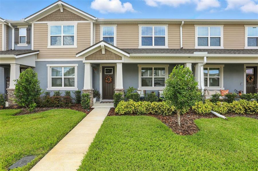 Front exterior of a new home in Waterbrooke, Clermont, FL, highlighting curb appeal (Image 23). Front exterior of a new home in Waterbrooke, Clermont, FL, highlighting curb appeal (Image 23).