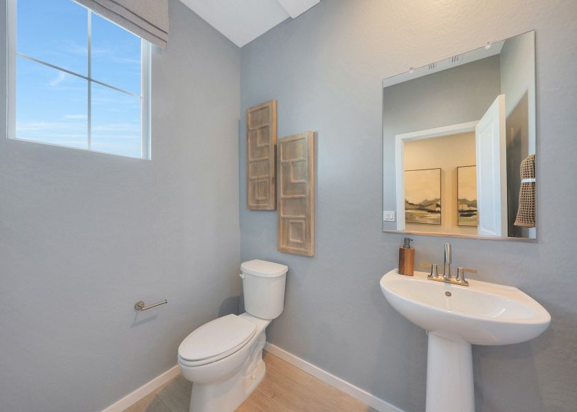 A bathroom with a toilet and sink.