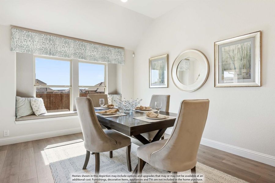 Dining room with dark wood table, upholstered chairs, window seat, and hardwood floors Dining room with dark wood table, upholstered chairs, window seat, and hardwood floors