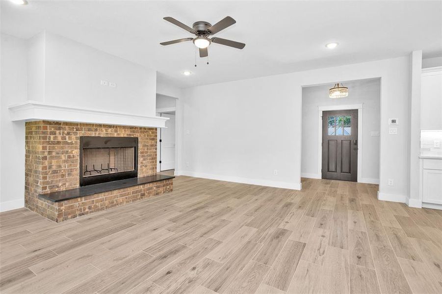 From the front door walk into the large family room with wood burning fireplace for those cozy winter days.