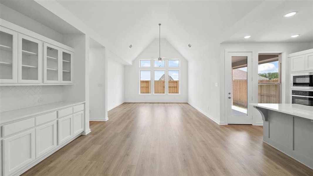 Dining to Family room with Vaulted ceiling