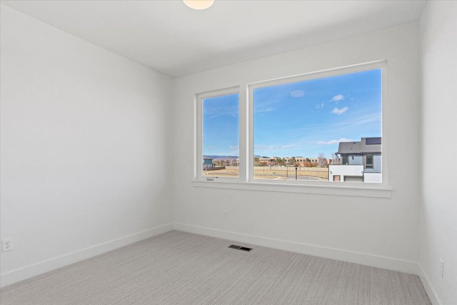 Spacious, unfurnished interior of a new home in West Grange, Longmont (Image 33).