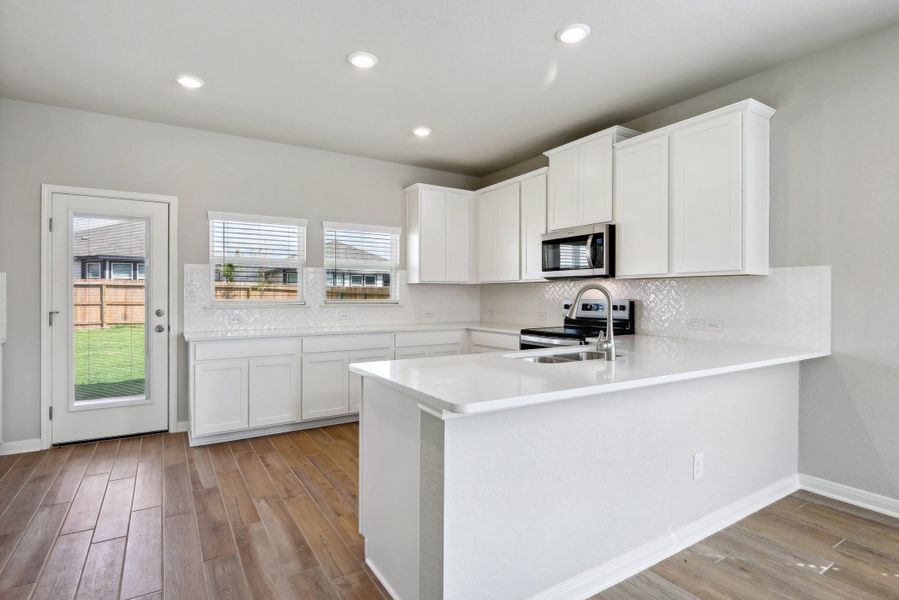 Kitchen in the Medina floorplan at a Meritage Homes community.