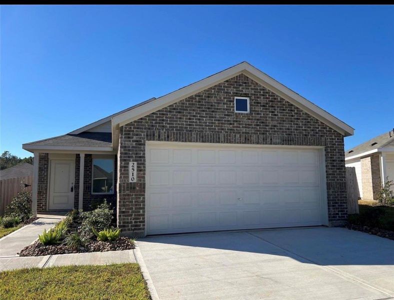 Front exterior of a new home in Meadow Park, Conroe, TX, highlighting curb appeal (Image 1). Front exterior of a new home in Meadow Park, Conroe, TX, highlighting curb appeal (Image 1).