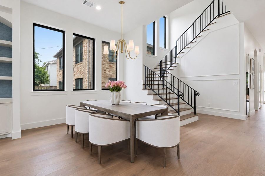 Light filled beautiful dinning room space with extensive windows