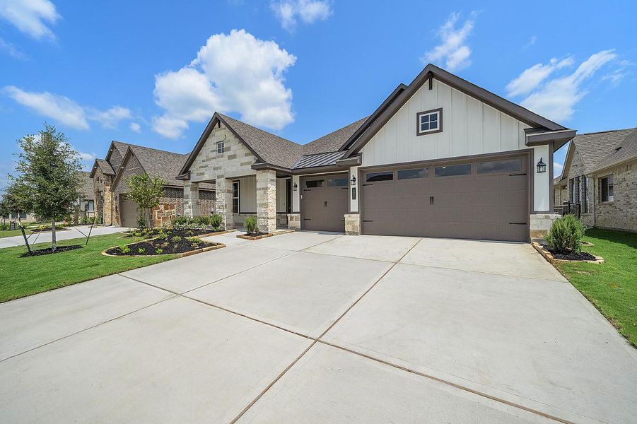 Representative exterior photo of a completed home built from the Daisy by Caldwell Homes in The Highlands, Porter, TX (Image 2). Representative exterior photo of a completed home built from the Daisy by Caldwell Homes in The Highlands, Porter, TX (Image 2).