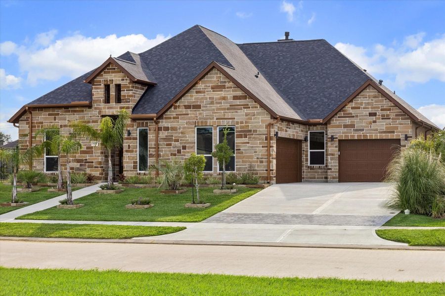 Front exterior of a new home in , Kemah, TX, highlighting curb appeal (Image 2). Front exterior of a new home in , Kemah, TX, highlighting curb appeal (Image 2).