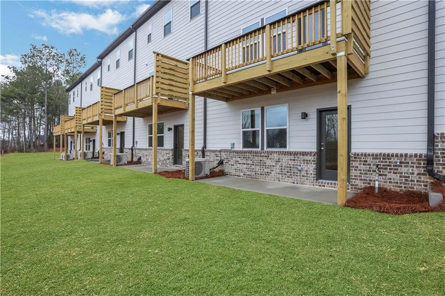 Exterior details and patio area of a home in Towne Village at Suwanee Dam, Sugar Hill (Image 26). Exterior details and patio area of a home in Towne Village at Suwanee Dam, Sugar Hill (Image 26).