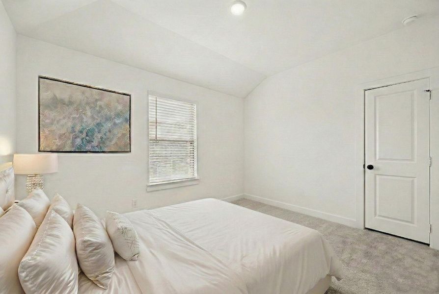 BEDROOM 5 FEATURES A VAULTED CEILING, NEUTRAL PAINT, AND A SINGLE WINDOW. **Virtually Staged.