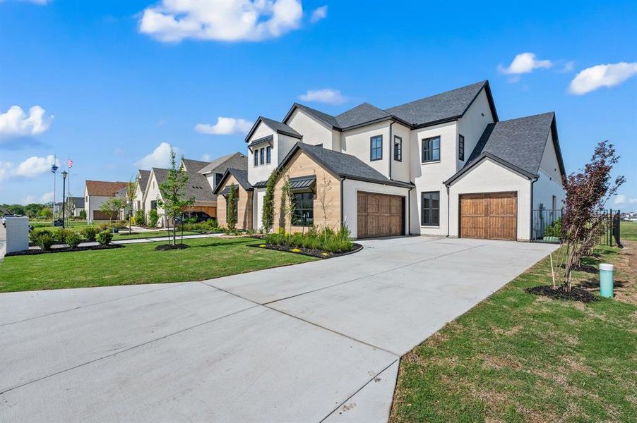 Front exterior of a new home in The Resort on Eagle Mt. Lake, Fort Worth, TX, highlighting curb appeal (Image 25).