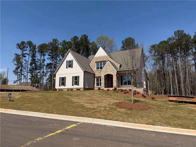 Front exterior of a new home in Woodford, Acworth, GA, highlighting curb appeal (Image 10).
