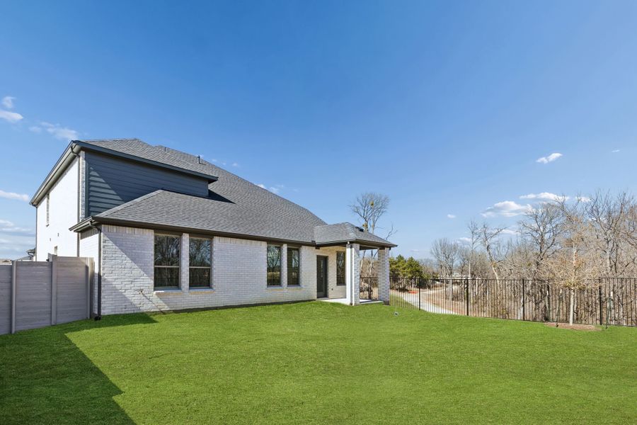 Covered Patio in the Masters home plan by Trophy Signature Homes – REPRESENTATIVE PHOTO