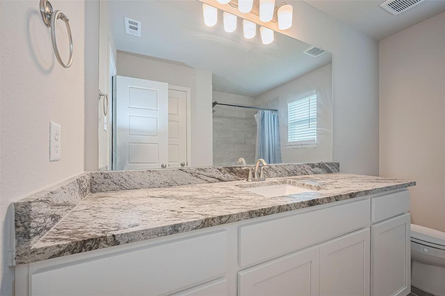 Furnished interior view inside a new home in Sunterra, Katy (Image 17).