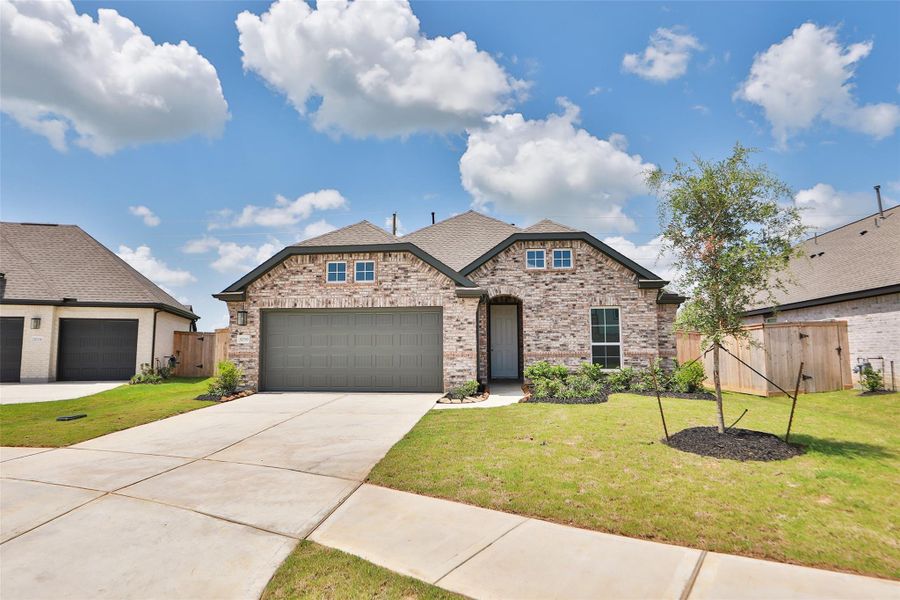 Front exterior of a new home in Oakwood Estates, Waller, TX, highlighting curb appeal (Image 21). Front exterior of a new home in Oakwood Estates, Waller, TX, highlighting curb appeal (Image 21).